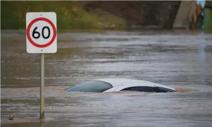  ??  ?? A car is submerged by flood water in Traralgon, Victoria in June 2021. The IPCC report predicts parts of Australia will be more prone to drought, while others will see more severe storms and increased flooding. Photograph: James Ross/AAP