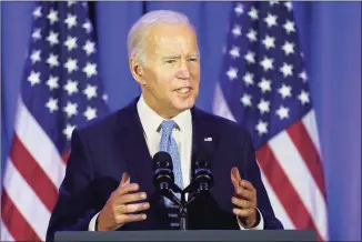  ?? Patrick Semansky / Associated Press ?? President Joe Biden speaks at a Democratic National Committee holiday party on Tuesday, in Washington. In a video released Tuesday, Biden spoke directly to the families of those killed at Sandy Hook Elementary School nine years ago, saying the nation owed families of mass shootings “more than our prayers. We owe them action.”