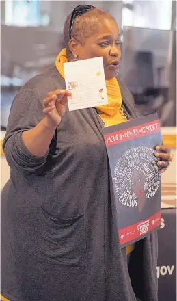  ?? ADOLPHE PIERRE-LOUIS/JOURNAL ?? Cathryn McGill of the New Mexico Black Leadership Council holds a poster and pamphlet that will be on display in barbershop­s and beauty parlors to raise awareness of the 2020 Census and its importance in the African American community.