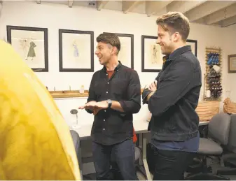  ?? Liz Hafalia / The Chronicle ?? Projection designer Adam Larsen (center) and director James Darrah (right) work on the “semi-staged” production of the opera “Boris Godunov” at the costume shop.