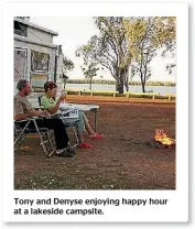  ??  ?? Tony and Denyse enjoying happy hour at a lakeside campsite.