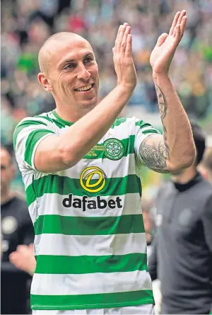  ?? Pictures: SNS Group. ?? Above: Scott Brown applauds the Celtic Park crowd at the end of yesterday’s testimonia­l match; left: the skipper with yesterday’s teammates and the club’s domestic trophy haul.