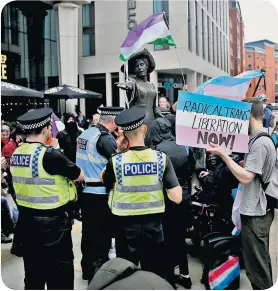  ?? ?? Shocking: the stand-off at the Emmeline Pankhurst statue in Manchester