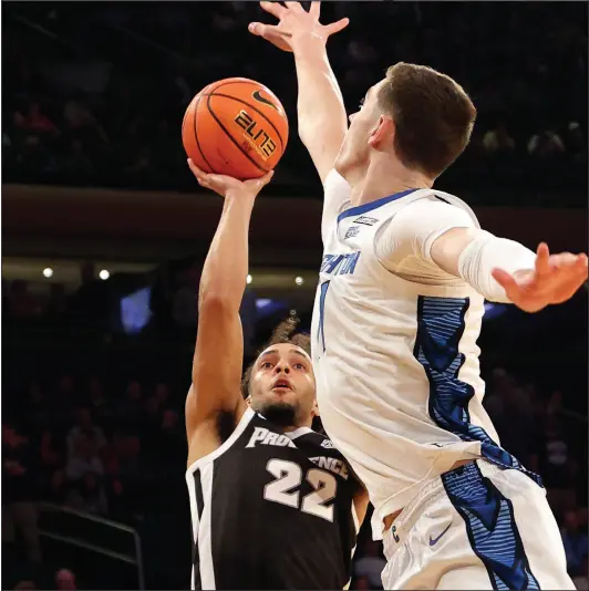  ?? Photo by Louriann Mardo-Zayat/lmzartwork­s.com ?? Devin Carter (22) finished with 27 points on Friday night, but it would not be enough as No. 7 PC fell to No. 10 Marquette, 79-68 in the semifinals of the Big East Tournament from Madison Square Garden.