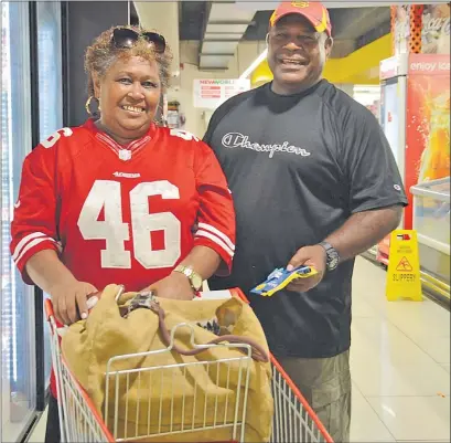  ?? Picture: RUSIATE VUNIREWA ?? Alumeci Koroibiau and her husband Api Whale shop for groceries at NewWorld IGA Supermarke­t in Suva.