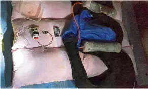  ?? — AP ?? Telling evidence: An explosive vest and bomb components found in the house in Jolo where Rullie and the two women were arrested.