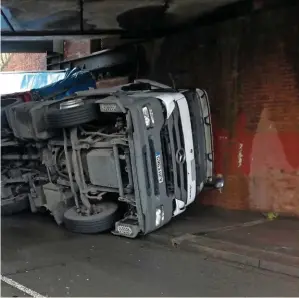  ?? NETWORK RAIL. ?? A lorry strikes Running Horse Bridge in Swindon on October 30 2017. Readers responding to Stefanie Foster’s Comments in RAIL 865 and 867 are calling for stronger prosecutio­n for bridge strike offenders.