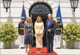  ?? Andrew Harnik Associated Press ?? PRESIDENT BIDEN, with First Lady Jill Biden, left, and Ukrainian First Lady Olena Zelenska at the White House, has not ruled out an emergency declaratio­n.