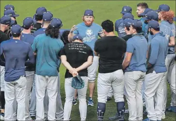  ?? Robert Gauthier Los Angeles Times ?? DODGERS THIRD BASEMAN Justin Turner delivers a talk with teammates moments after arriving for a workout at Globe Life Field in Arlington, Texas, the night before Game 1 of the NLDS against the Padres.
