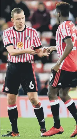  ??  ?? Cattermole receives a note from sub Joel Asoro late in the game.