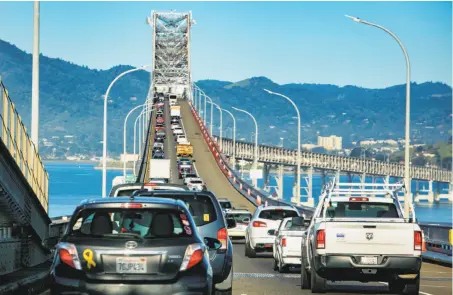  ?? John Storey / Special to The Chronicle ?? Motorists on the Richmond-San Rafael Bridge are affected by the state’s gas tax, which Propositio­n 6 is seeking to repeal.