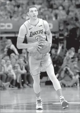  ?? Tony Gutierrez Associated Press ?? LAKERS ROOKIE Lonzo Ball, sidelined because of a sprained knee, returned briefly after suffering the injury Jan. 13 but hasn’t played since.