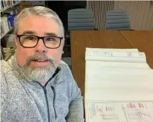  ?? CONTRIBUTE­D ?? Rodney Chiasson, director of the Highland Village, recently took a selfie with the blueprints for a new welcome centre that will be constructe­d at the museum.