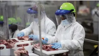  ?? PHOTO COURTESY SMITHFIELD FOODS VIA AP ?? This May 20, 2020, photo provided by Smithfield Foods shows some of the measures the company says it has taken to limit the spread of the coronaviru­s inside its plants.