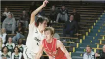  ?? DAVID GARRETT/SPECIAL TO THE MORNING CALL ?? Parkland’s Nick Coval, right, remains the area’s leading scorer at over 23 points a game. He’s shown driving against Central Catholic’s Nico Puleri.