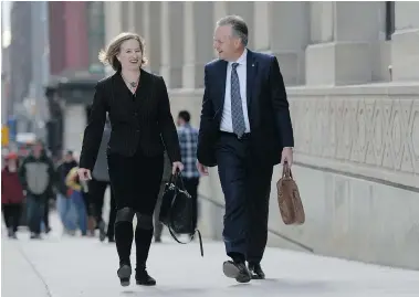  ?? SEAN KILPATRICK/The Canadian Press ?? Bank of Canada Governor Stephen Poloz and Senior Deputy Governor Carolyn Wilkins head to a news conference at the
National Press Theatre in Ottawa on Wednesday.