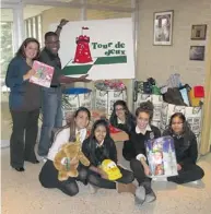  ??  ?? The toy drive organized at Marymount Academy on December 5th was very successful thanks to the students, the teachers, support staff and everyone who donated: Staff members Maya Doughan, David Mills and students Hanna Hyatoola, Ikalika Vairamuthu,...