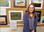  ??  ?? Sonoravill­e High School student Makayla Hufstetler, a freshman, poses next to her artwork at the Hunter Museum of American Art.