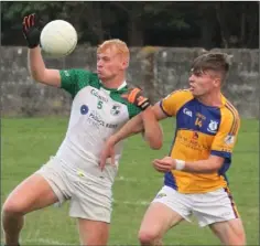  ??  ?? Darragh Lyons of St. James’ battling it out with Ian Carty.