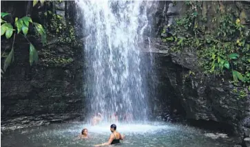  ?? Grenada Tourism Authority ?? Cooling off at the Seven Sisters Falls in Grenada.