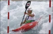  ?? VICTOR R. CAIVANO — THE ASSOCIATED PRESS FILE ?? Japan’s Kazuki Yazawa competes in the men’s K-1kayak slalom semifinal at the Lee Valley White Water Center at the 2012Summer Olympics in Waltham Cross, near London. The 27-year-old Yazawa, a Buddhist monk at Zenkoji Daikanjin Temple in Nagano, will...