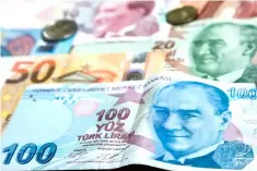  ?? — AFP photo ?? The lira has collapsed by 40 per cent this year. Turkish banks that borrowed heavily abroad now face the near impossible task of refinancin­g short-term debt in expensive dollars and euros.