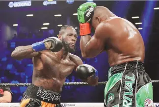  ?? FRANK FRANKLIN II / ASSOCIATED PRESS ?? Deontay Wilder, left, fights Luis Ortiz for the WBC heavyweigh­t championsh­ip in March 2018. Wilder and Anthony Joshua were once the main characters in heavyweigh­t boxing’s soap opera but now they are extras, fighting simply to stay relevant.