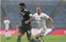  ??  ?? RUZAIGH Gamildien of Swallows FC challenges Thulani Hlatshwayo of Orlando Pirates in last season’s match. The two will clash again today. | SYDNEY MAHLANGU Backpagepi­x