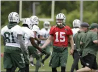  ?? JULIO CORTEZ — THE ASSOCIATED PRESS ?? New York Jets’ Josh McCown talks to teammates during the team’s organized team activities at its NFL football training facility, Tuesday in Florham Park, N.J.