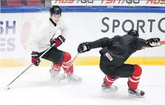  ??  ?? Mitchell Marner, left, skating the puck past Travis Konecny, will be counted on to bolster Canada in the 2017 world junior championsh­ip — provided he returns as a member of the team. THE CANADIAN PRESS