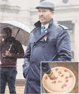  ??  ?? LEST WE FORGET. A man wearing a remembranc­e poppy braves the rain during the commemorat­ion day of the 100-year anniversar­y of the sinking of the SS Mendi yesterday at Beyers Naude Square in the Johannesbu­rg CBD. Picture: Alaister Russell Inset: Members...