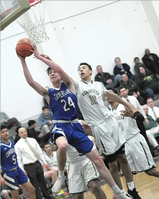  ?? Photo by Ernest A. Brown ?? Cumberland senior center Jackson Zancan (24) glides past Hendricken junior Nick Coffey (12) during the second half of the No. 16 Clippers’ shocking 62-55 victory over the three time defending state champions in the first round of the Open tournament at Cranston East Thursday night.