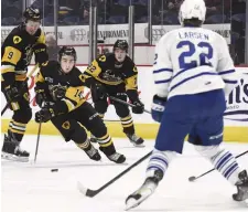  ?? JOHN RENNISON THE HAMILTON SPECTATOR ?? Bulldogs’ George Diaco heads for the net with teammates Logan Morrison, left, and Ryan Humphrey against Mississaug­a’s Kasper Larsen.