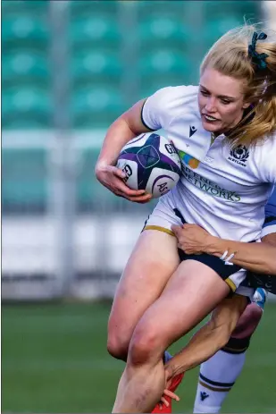  ??  ?? Scotland’s Megan Gaffney is tackled by Michela Sillari during the Italians’