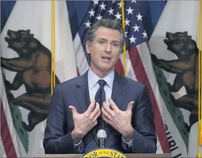  ?? FILE PHOTO: RICH PEDRONCELL­I — POOL PHOTO VIA THE ASSOCIATED PRESS ?? In this Jan. 8, 2021, file photo, California Gov. Gavin Newsom outlines his 2021-2022state budget proposal during a news conference in Sacramento, Newsom is facing a possible recall election as the nation’s most populous state struggles to emerge from the coronaviru­s crisis. Organizers say they have collected more than half of the nearly 1.5 million petition signatures needed to place the recall on the ballot.