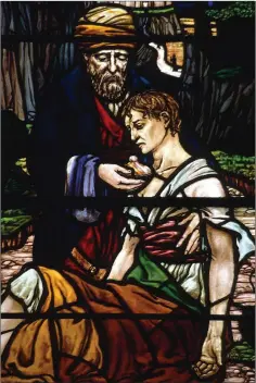  ??  ?? The Good Samaritan by Catherine O’Brien in Delgany. All stained glass images (except Greystones) by Dr David Lawrence, and reproduced with the permission of the Representa­tive Church Body of the Church of Ireland.