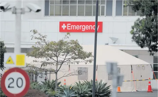  ?? Photo / Michael Craig ?? A triage tent has been erected in the grounds of the North Shore hospital in Milford.