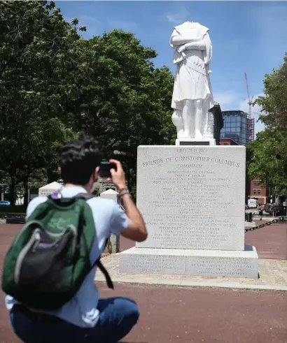  ?? NAnCy lAnE / HERAlD STAff filE ?? REMOVED: The Christophe­r Columbus statue in Boston was damaged in June 2020. It has since been removed, leaving just the pedestal, seen on Sept. 28.
