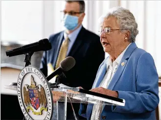  ?? MICKEY WELSH / THE MONTGOMERY ADVERTISER VIA AP / FILE ?? Back in June 2020: Alabama’s governor, Kay Ivey, and State Health Officer Dr. Scott Harris ask citizens to continue wearing masks and use social distancing during a coronaviru­s update in the state capitol building in Montgomery, Ala..