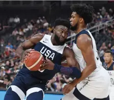  ?? GETTY IMAGES ?? POWER MOVE: Jaylen Brown drives against Marvin Bagley during Team USA’s Blue-White exhibition game Friday night in Las Vegas.