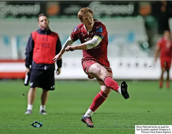  ?? ?? Rhys Patchell kicks at goal for the Scarlets against Dragons A.
Picture: Huw Evans Agency