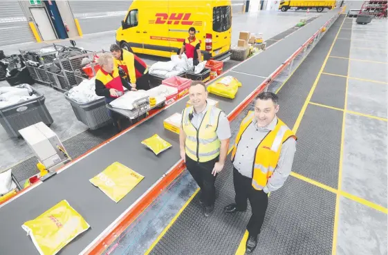  ?? Picture: RICHARD GOSLING ?? Peter Krstevski (left) and Matthew Inglis, from DHL Express, which will today open its new distributi­on centre in Molendinar.