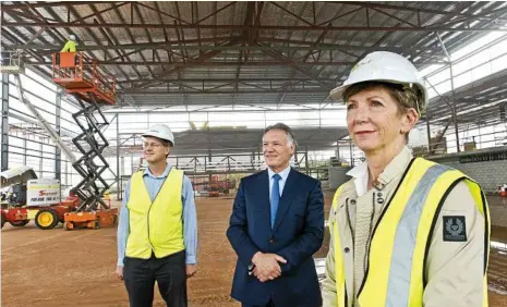  ?? PHOTOS: NEV MADSEN ?? MAJOR BUILD: Northbuild project manager Andrew Civil (left), Toowoomba Grammar School headmaster Peter Hauser and Aspect Architects project manager Ann Coppard at the school’s multi-million dollar gymnasium.