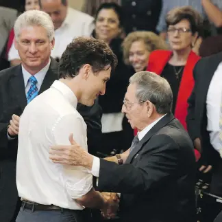  ?? ENRIQUE DE LA OSA / POOL PHOTO VIA AP ?? Prime Minister Justin Trudeau, left, shakes hands with Cuban President Raul Castro during an event Wednesday at Havana University in Havana, Cuba. Trudeau is on an official visit to Cuba.