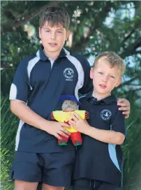  ?? ?? Year 6 student Joel Rigby and Prep student Archie Easton with buddy bear Lava.