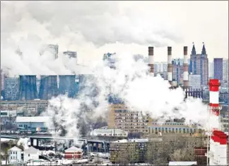  ?? ALEXANDER NEMENOV/AFP ?? Steam and smoke rise from cooling towers and chimneys of a coal-fired power plant in Moscow, Russia.