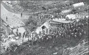  ?? AP/TSUYOSHI UEDA ?? Rescuers search for survivors Friday at the site of a landslide in Atsuma, Japan, that was triggered by Thursday’s earthquake.