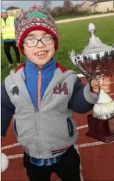  ??  ?? Tadhg Mac Eochaidh with the trophy.