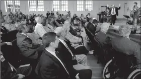  ?? AP/ERIC GAY ?? Pastor Frank Pomeroy (back right) raises his hands Sunday as he speaks during a dedication ceremony for a new sanctuary and memorial room at the First Baptist Church in Sutherland Springs, Texas.