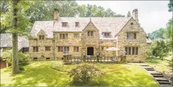  ??  ?? This English villa manor set on 3.21 acres features hand-forged iron work, leaded glass windows and exquisite Italianate details throughout.